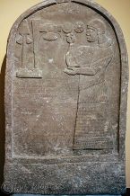 Assyrian relief showing palace official praying